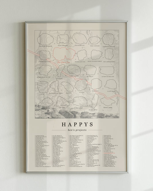 A cream color, customized rock climbing ticklist poster for the Happys rock climbing location in Bishop, California. The design has an overlay of crag topography, nature landscapes, and traced boulders, the person's name, and a list of bouldering problems at the bottom. Displayed as wall art in a living room.