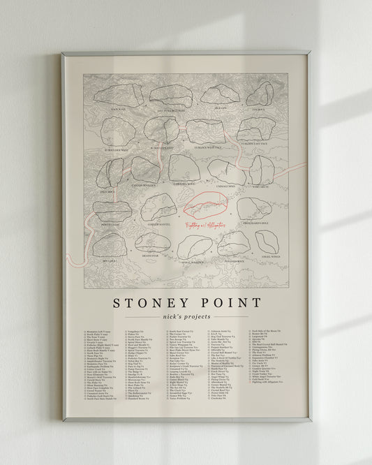 A cream color, customized rock climbing ticklist poster for the Buttermilks rock climbing location in Topanga, California. The design has an overlay of crag topography, nature landscapes, and traced boulders, the person's name, and a list of bouldering problems at the bottom. Displayed as wall art in a living room.