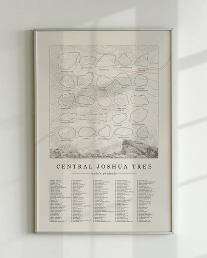 A cream color, customized rock climbing ticklist poster for the JTree Central rock climbing location in Joshua Tree, California. The design has an overlay of crag topography, nature landscapes, and traced boulders, the person's name, and a list of bouldering problems at the bottom. Displayed as wall art in a living room.